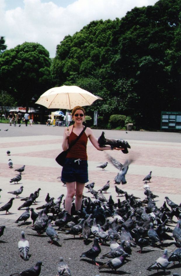 My sister feeding pigeons in Ueno Park